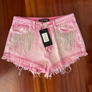 New with tags pink shorts with rhinestones on pockets. New with tags.